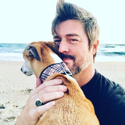 Kyan is taking holding Maya as she's watching the sunrise.